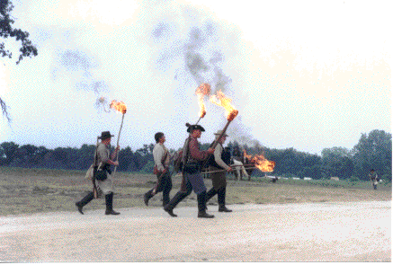 Some of the 2nd Mo Cav playing with matches at Warrenton, Mo 2002